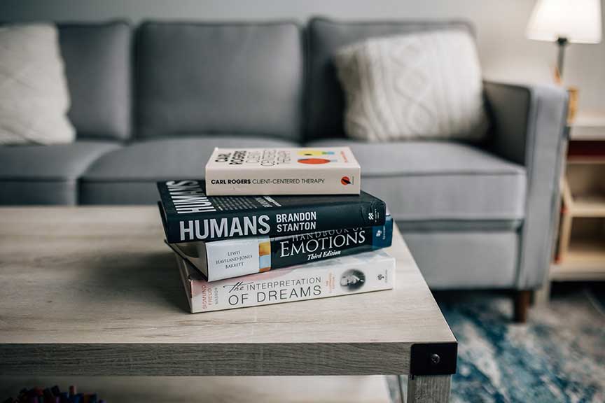 stack of books on a coffee table