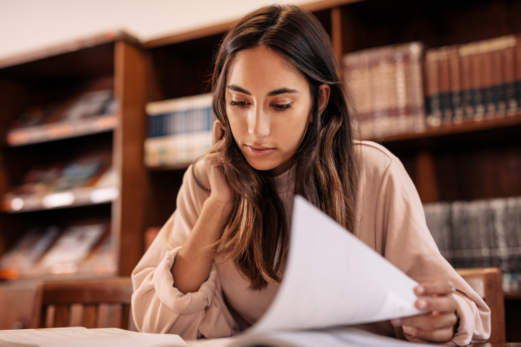 college student in library studying